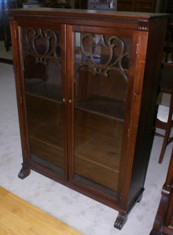 two door walnut antique bookcase with lattice work doors