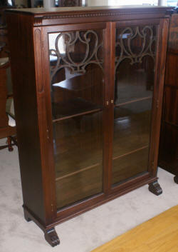 two door walnut antique bookcase with lattice work doors