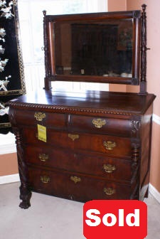 heavily carved antique paw foot chest with mirror