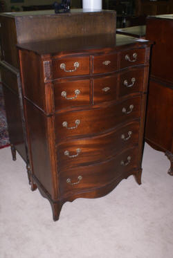 Serpentine front mahogany antique chest