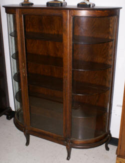 Solid oak antique bow glass china cabinet