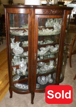 Walnut triple bow front antique china cabinet