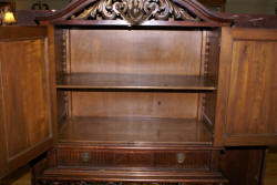 walnut heavily carved antique blind door crystal cabinet with built in butlers desk