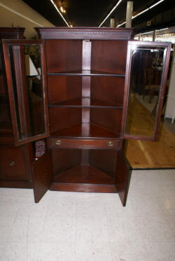 Beveled glass dark mahogany corner cabinet