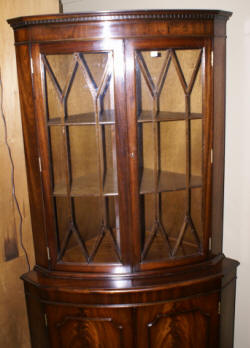 English flame mahogany antique corner cabinet