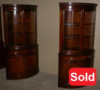 Matched pair of Drexel mahogany corner cabinets