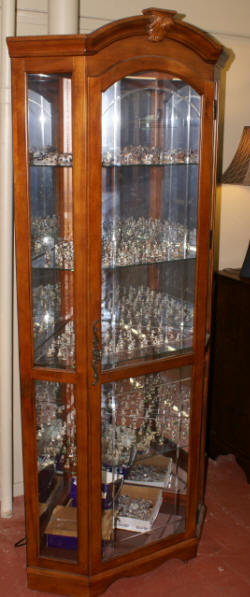 Lighted etched glass front corner curio cabinet