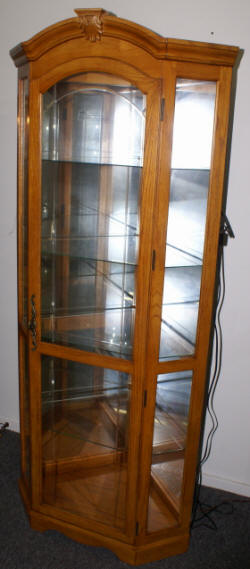 Lighted etched glass front oak corner curio cabinet by Pulaski Furniture Company