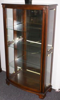 Mahogany bow front glass door curio cabinet by Pulaski Furniture Company