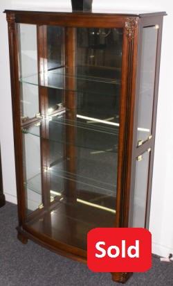 Mahogany bow front glass door curio cabinet by Pulaski Furniture Company