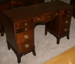 Urn inlaid mahogany kneehole desk