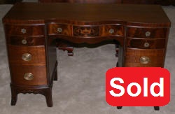 Urn inlaid mahogany kneehole desk