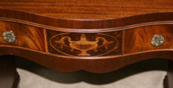 Urn inlaid mahogany kneehole desk