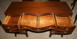 Urn inlaid mahogany kneehole desk