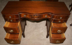 Urn inlaid mahogany kneehole desk