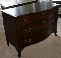 Heavily inlaid antique mahogany bow front dresser