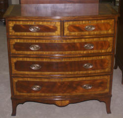 Heavily inlaid mahogany bow front dresser