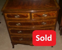 Heavily inlaid mahogany bow front dresser