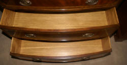 Heavily inlaid mahogany bow front dresser