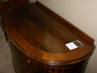 Demi-lune walnut inlaid antique dresser