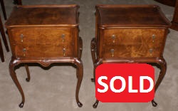 Matched pair of mahogany round drum top Regency night stands