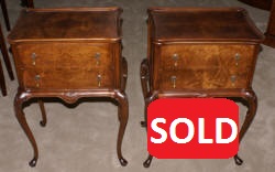 Matched pair of mahogany round drum top Regency night stands 