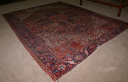 Handmade Persian Heriz worn antique rug 