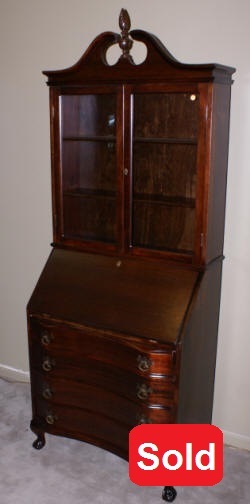 mahogany serpentine front secretary desk