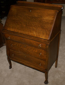 Tiger oak slant lid secretary desk with paw feet 