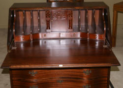 Antique mahogany serpentine front mahogany governor Winthrop desk 