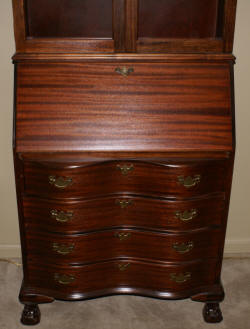 Serpentine front mahogany secretary desk