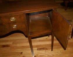 Inlaid bow front walnut sideboard