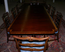 Banded inlaid modern mahogany dining room table with a set of 8 1940s ribbon back solid mahogany dining room chairs