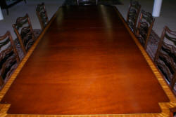 Banded inlaid modern mahogany dining room table with a set of 8 1940s ribbon back solid mahogany dining room chairs