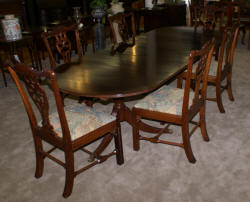 Oval banded inlaid mahogany dining room table and six solid mahogany dining room chairs