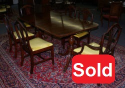 Mahogany banded inlaid Duncan Phyfe dining room table and set of six shield back dining room chairs