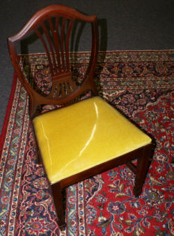 Mahogany banded inlaid Duncan Phyfe dining room table and set of six shield back dining room chairs