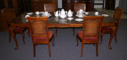 solid cherry dining room table and six cane back dining room chairs