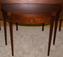 Mahogany urn inlaid flip top game table  