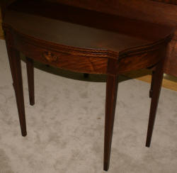 Mahogany urn inlaid flip top game table  