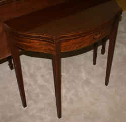 Mahogany urn inlaid flip top game table  