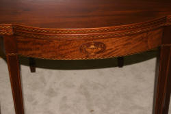 Mahogany urn inlaid flip top game table  