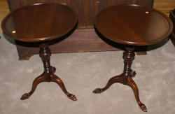 Matched pair of round paw foot side tables