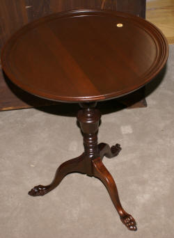 Matched pair of round paw foot side tables