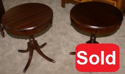 Matched pair of round mahogany living room tables