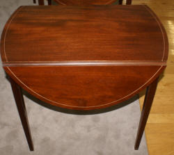 Matched pair of mahogany inlaid Pembroke tables 