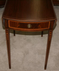 Matched pair of mahogany inlaid Pembroke tables 