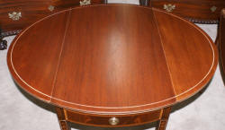 Matched pair of mahogany inlaid Pembroke tables 